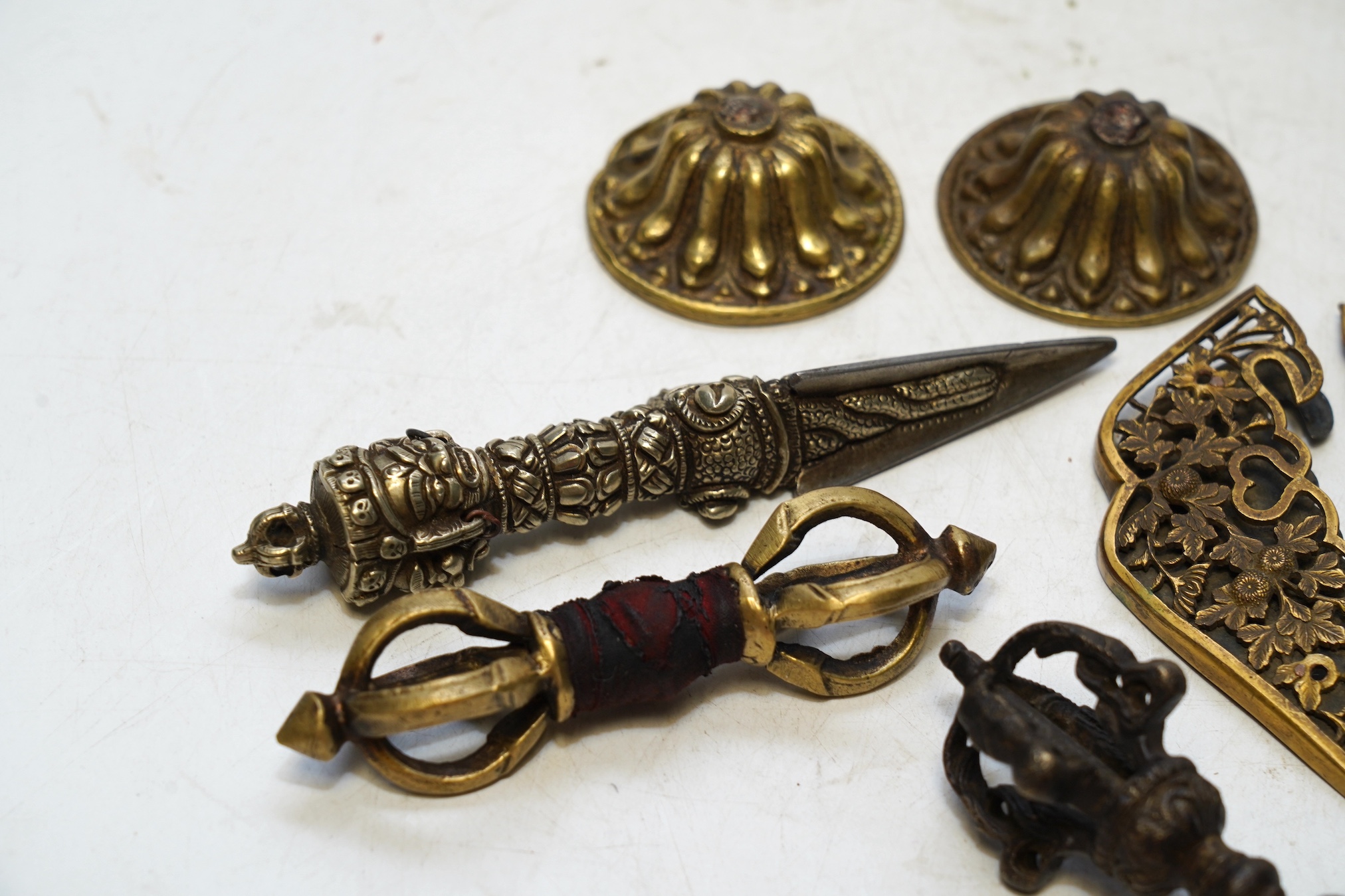 Chinese and Tibetan metalware including a phurba, largest 14cm. Condition - fair